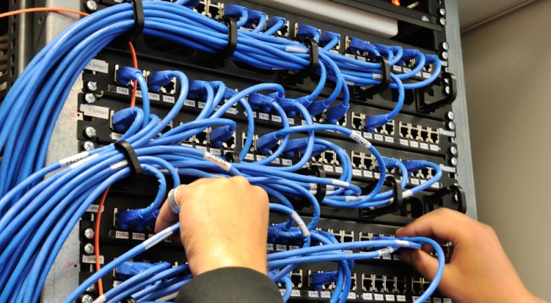 Man Connecting Network Wires