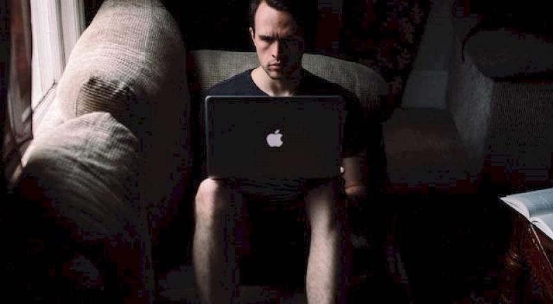 Man Working Alone in the Dark